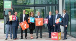Photo of business leaders supporting the Global Goals